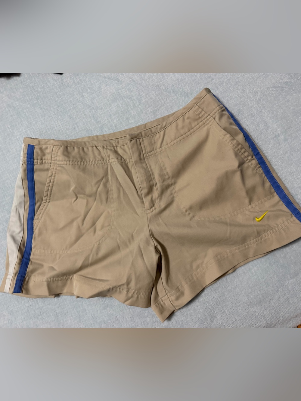 Nike Men’s Beige Athletic Shorts with Blue and Yellow Accents